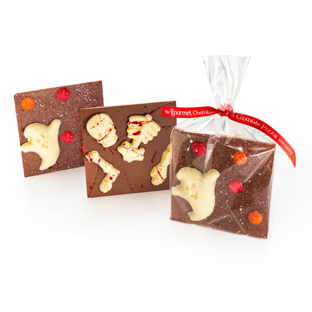 Halloween bars - milk chocolate squares with white chocolate halloween-themed decorations.